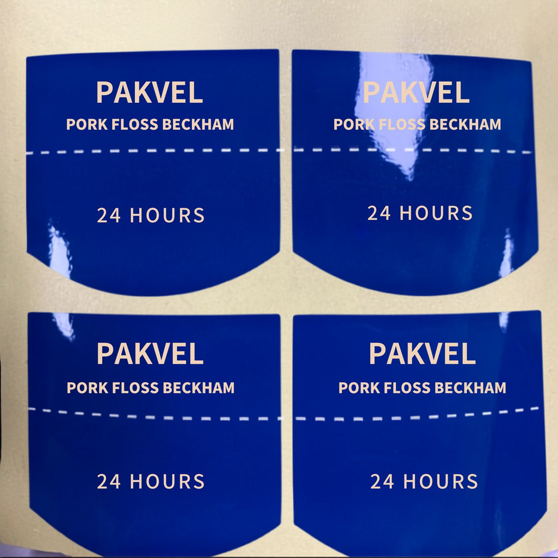 Custom die-cut glossy coated paper stickers, full-colour print on a kraft parcel