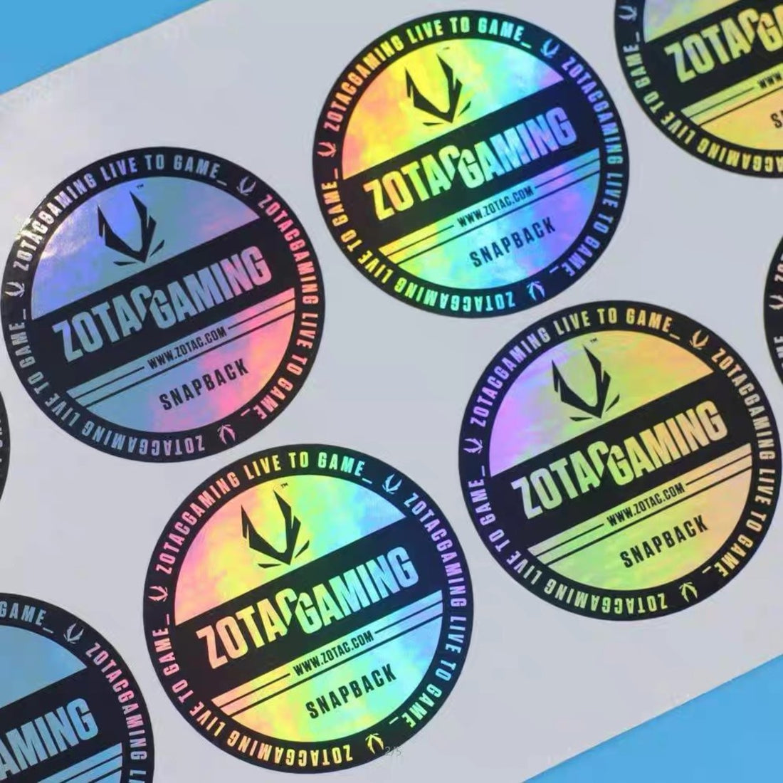 Sheet of round holographic logo stickers — Pakvel