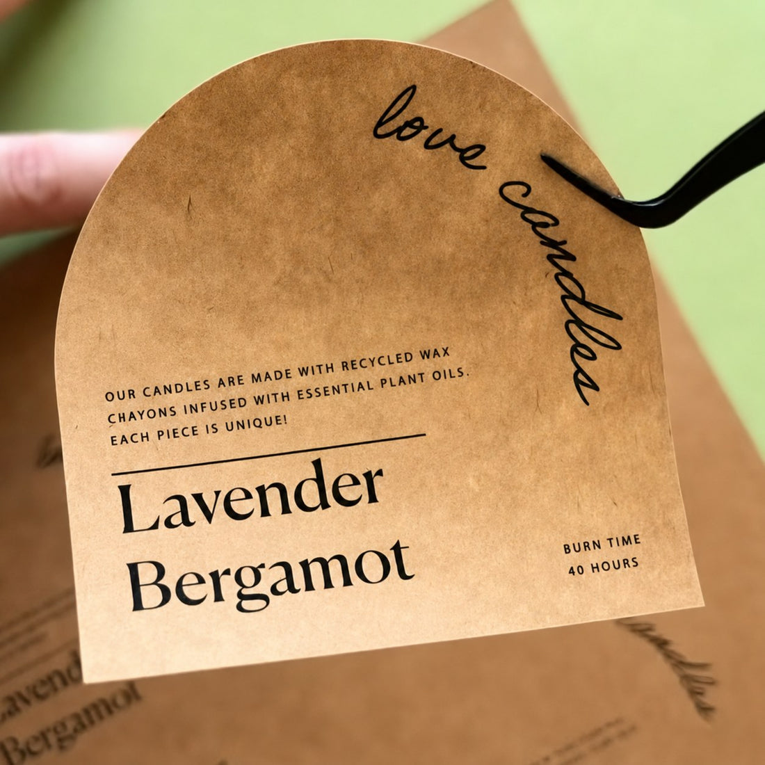 Kraft hang tag on a lavender candle — Pakvel