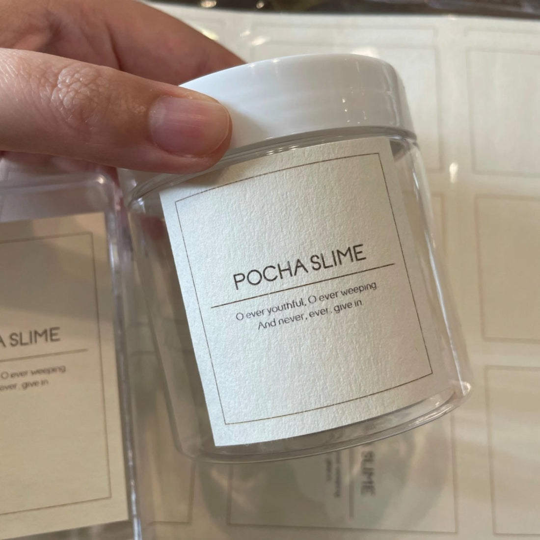 Textured paper product label on a cosmetic jar, premium felt-textured packaging label