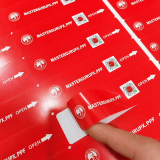 Red glossy coated paper sticker sheet with die-cut custom labels and open-here arrows, kiss-cut