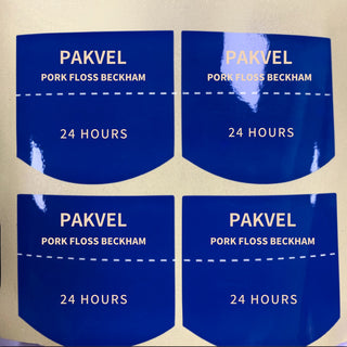 Custom die-cut glossy coated paper stickers, full-colour print on a kraft parcel