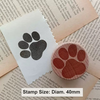 Custom round rubber stamp, 40 mm diameter, beside its stamped impression