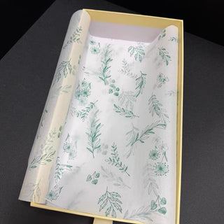Custom printed 17gsm tissue paper lining a cream gift box