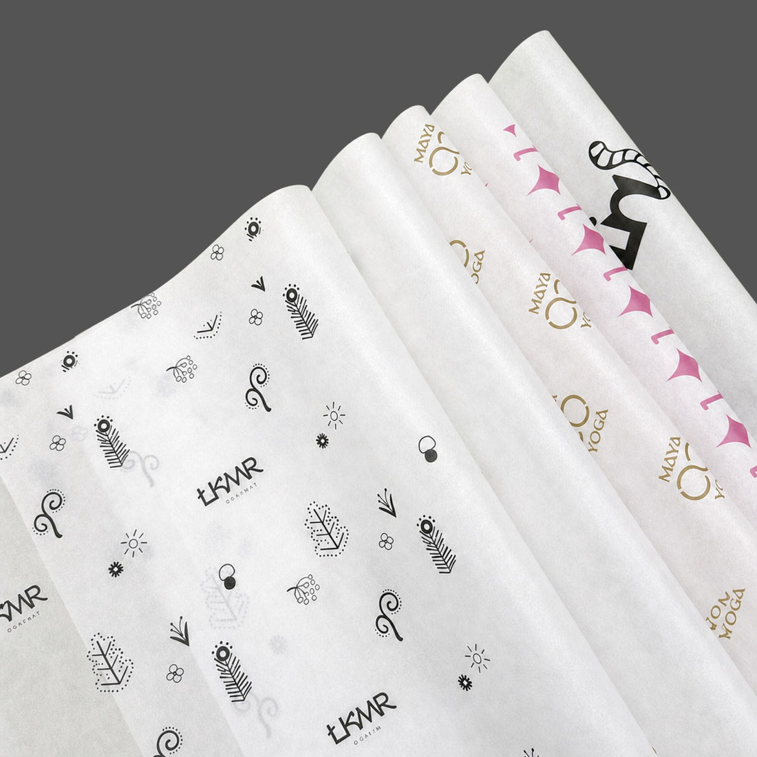 Five rolls of 17gsm tissue paper with different custom logo prints