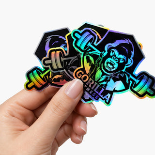 Holographic film die-cut sticker with a rainbow iridescent laser finish, held in hand