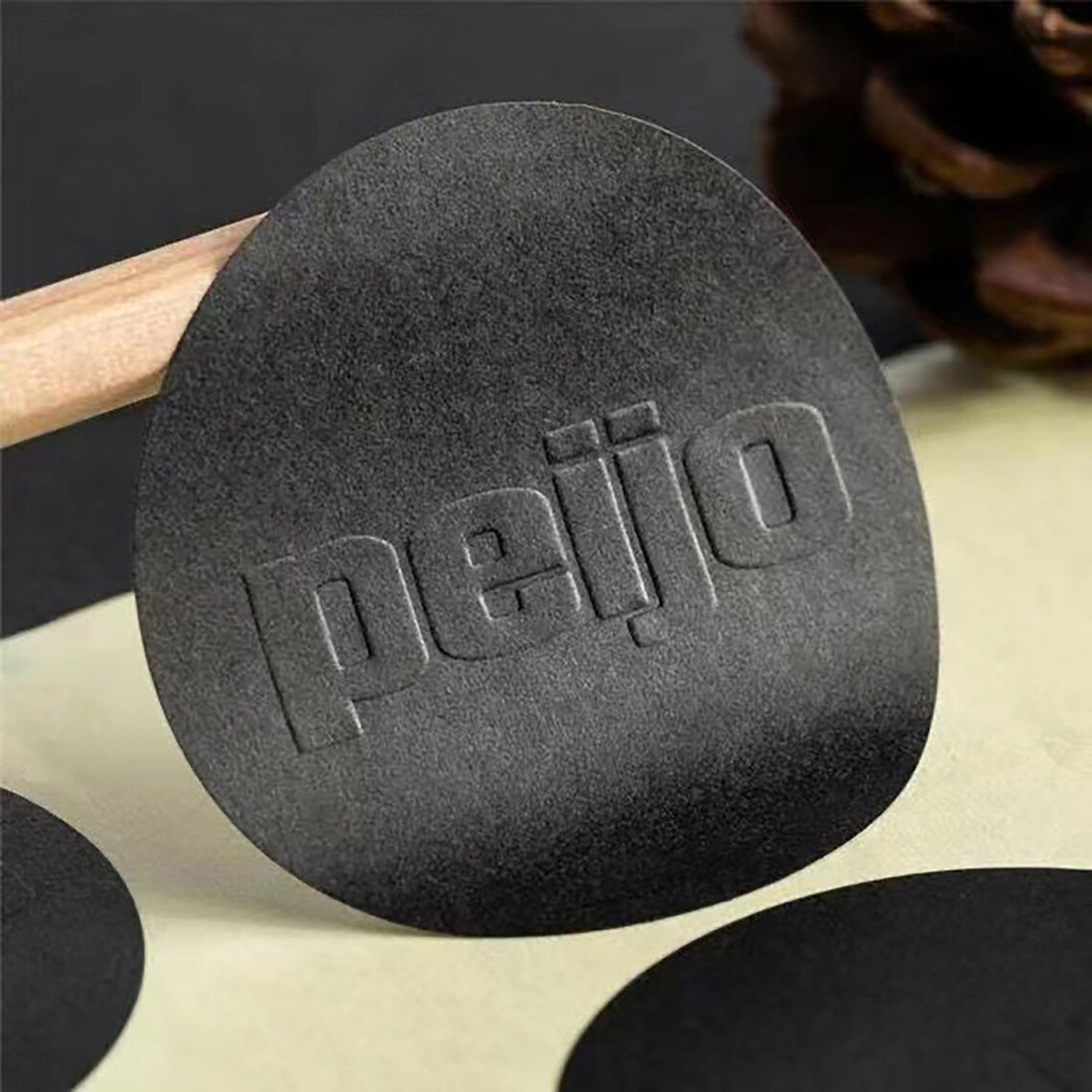 Black debossed custom sticker on a craft scene — Pakvel