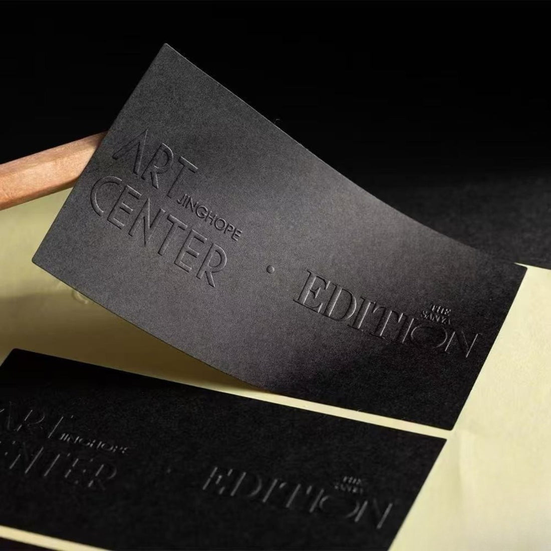 Black embossed rectangle label with pressed texture — Pakvel