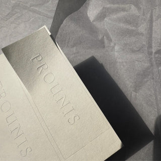 Close-up of a white embossed label — Pakvel