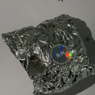 Close-up of a holographic sticker rainbow shimmer — Pakvel
