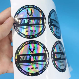 Hand holding a sheet of holographic stickers — Pakvel