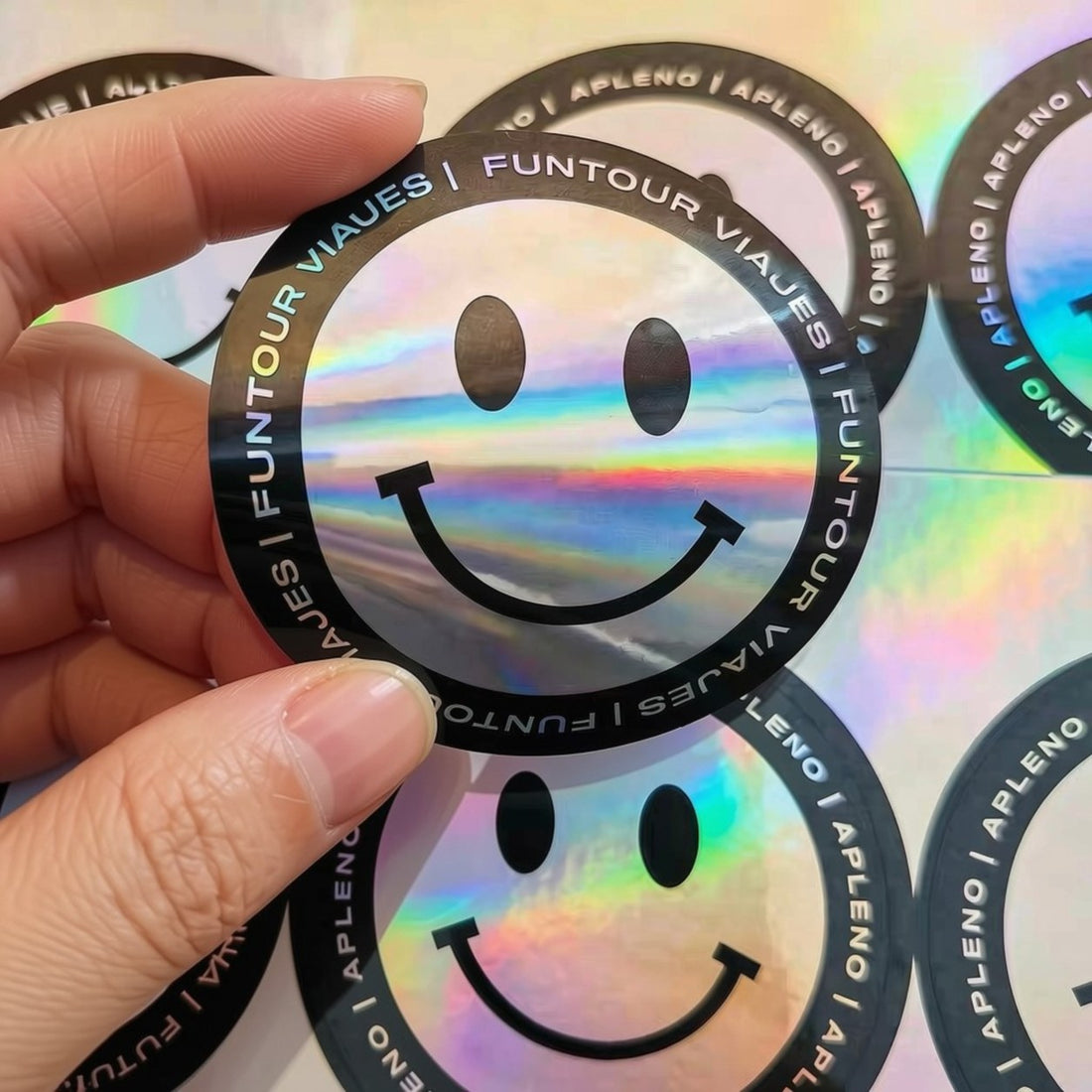 Round holographic smiley-face sticker — Pakvel