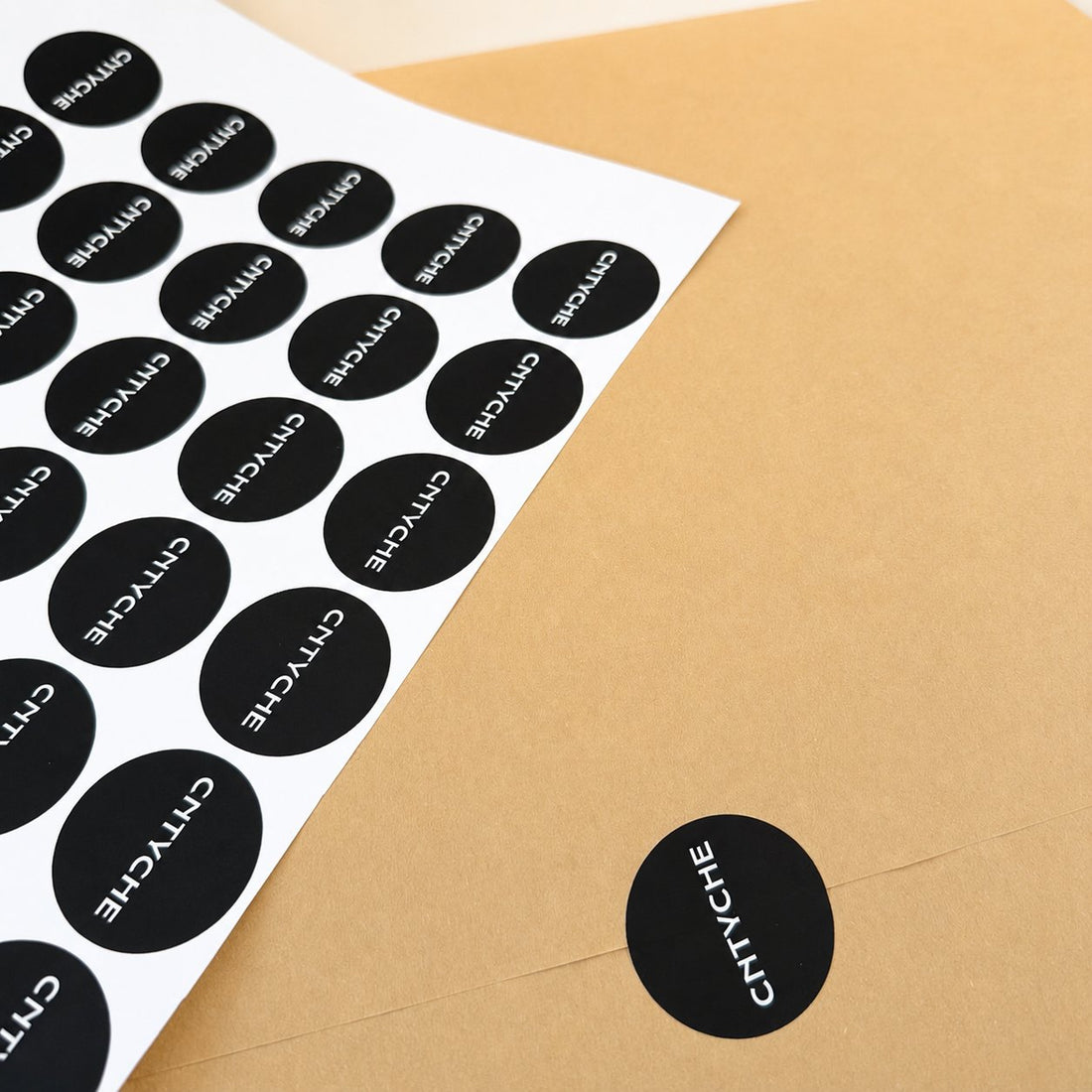 Kiss-cut sheet of black circle matte paper stickers on kraft paper, custom matte sticker sheet