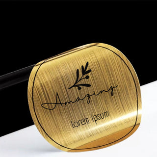 Round brushed gold metallic sticker with black printed lettering, full-color print on brushed gold foil