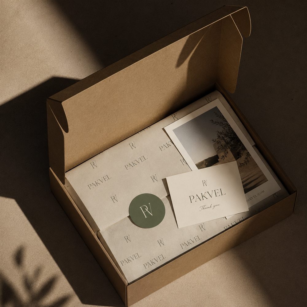 Custom die-cut logo stickers tucked into every order — Pakvel