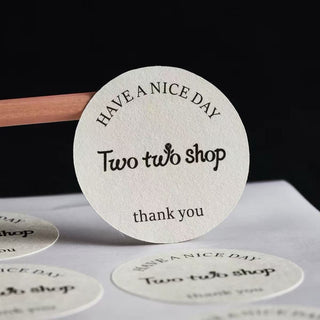 Round textured pearl paper sticker with a felt finish, custom circle label